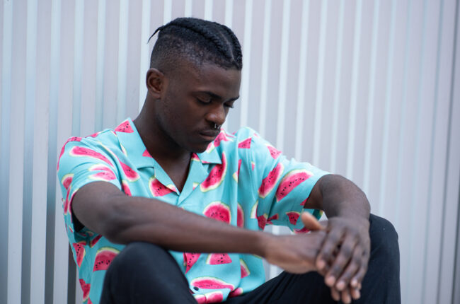 Portrait,Of,A,Handsome,Young,Fashion,Afro,Guy,Sitting